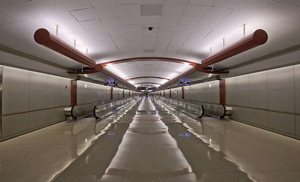 An empty moving walkway at Dulles Airport.
